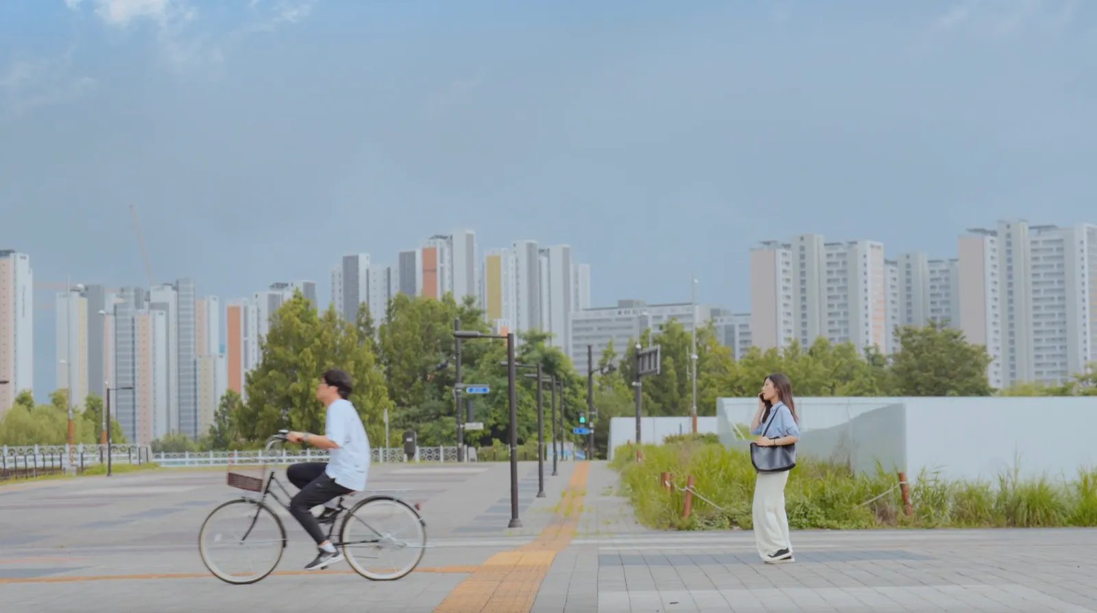 An empty lot on the way to work. A bicycle passes by